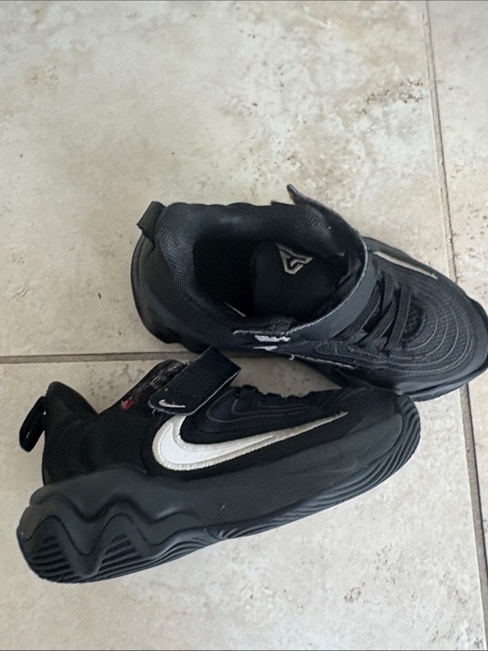 Nike Black Sneakers with White Swoosh Accent
